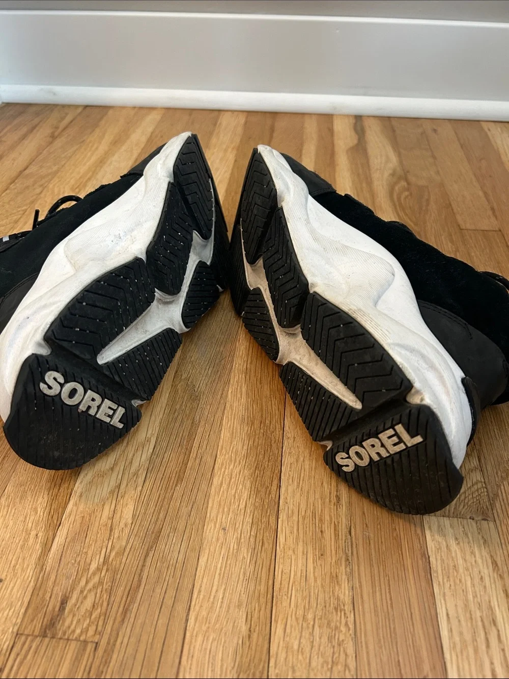 Sorel. Women’s Black Chunky Sneaker with White Sole.